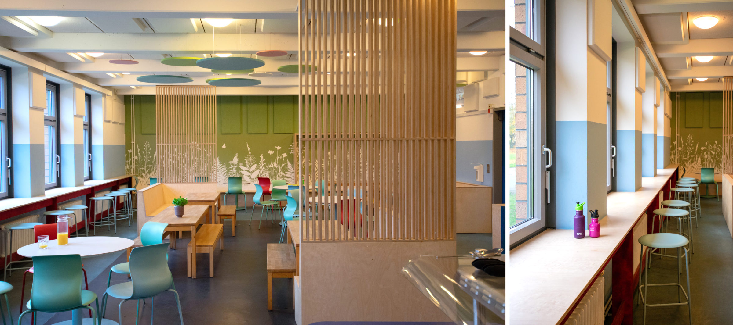 Neu gestaltete Mensa der Clara-Grunwald-Schule mit Stehtisch an der Fensterfront, Sitznischen mit Eckbänken und raumgliedernden Holzlamellen zur Zonierung.